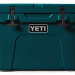 Yeti Tundra 35 Hard Cooler - A large, rectangular cooler with a dark gray lid and matching body, featuring a handle on top and a logo in silver lettering that reads "YETI" on the front.