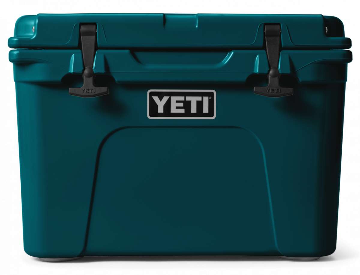 Yeti Tundra 35 Hard Cooler - A large, rectangular cooler with a dark gray lid and matching body, featuring a handle on top and a logo in silver lettering that reads "YETI" on the front.