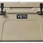 Yeti Tundra 45 Cooler - A large, tan cooler with a black handle on top and two latches on either side of it.