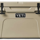 Yeti Tundra 45 Cooler - A large, tan cooler with a black handle on top and two latches on either side of it.