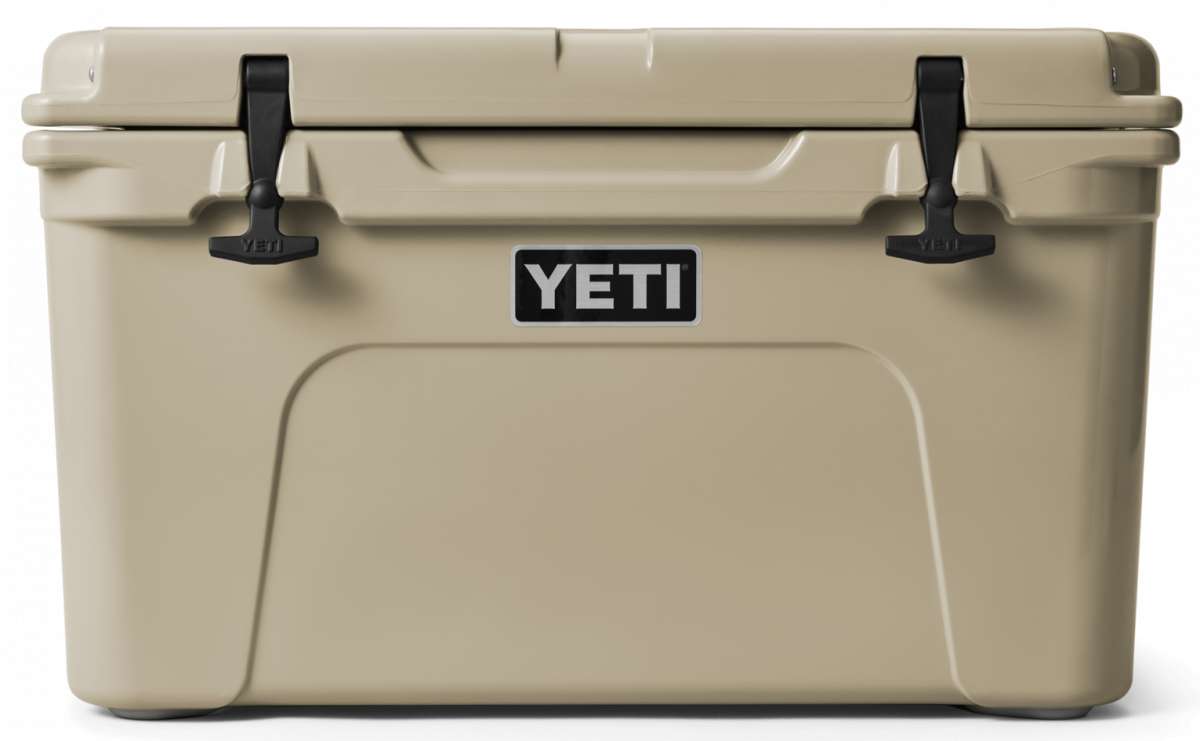 Yeti Tundra 45 Cooler - A large, tan cooler with a black handle on top and two latches on either side of it.