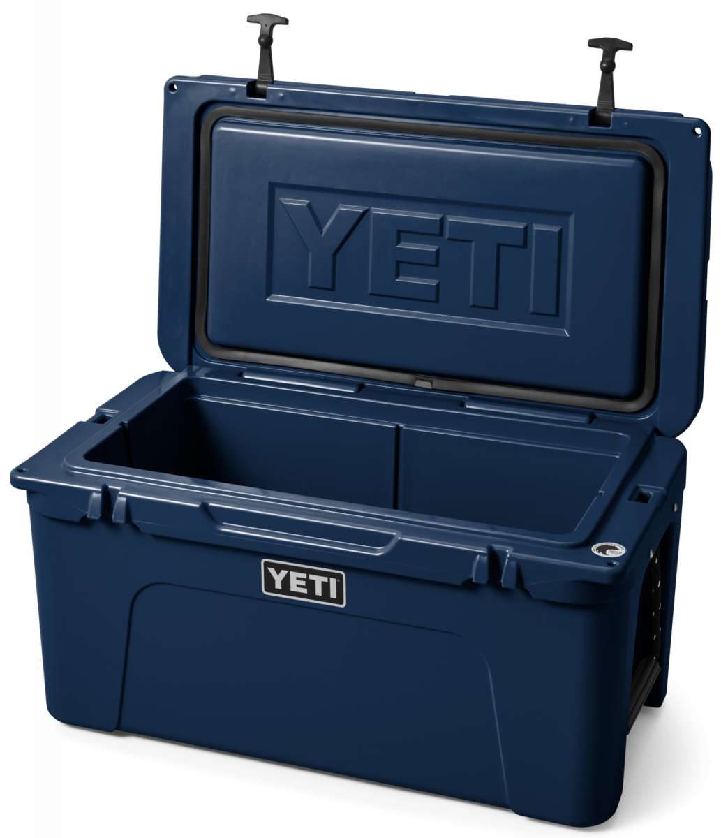 Yeti Tundra 65 Cooler - A large, rectangular cooler with a dark gray lid and matching body, featuring a prominent "YETI" logo on the front in white lettering.