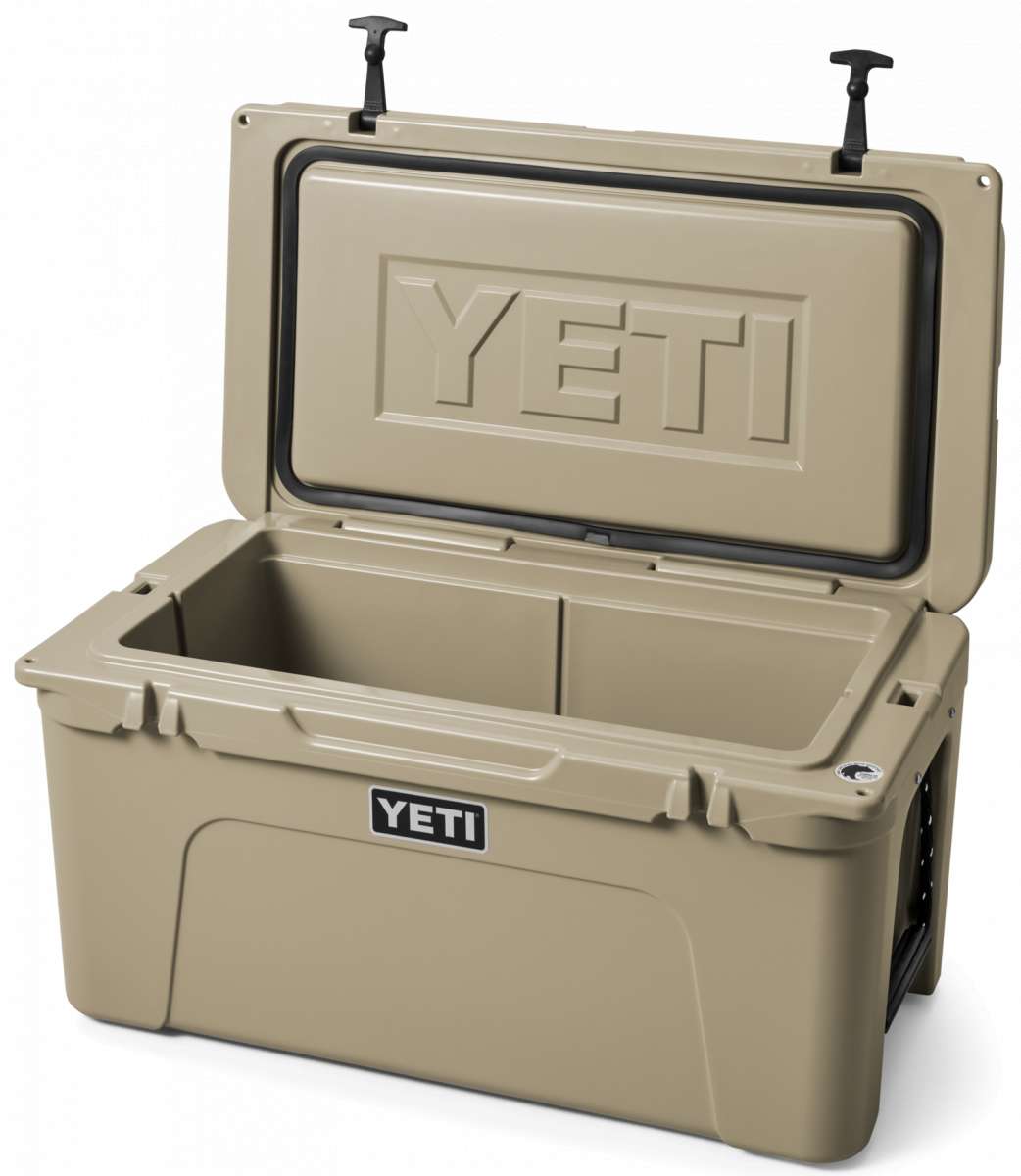 Yeti Tundra 65 Cooler - A tan cooler with a black handle on top, featuring the word "YETI" embossed in silver letters on one side.
