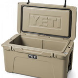 Yeti Tundra 65 Cooler - A tan cooler with a black handle on top, featuring the word "YETI" embossed in silver letters on one side.
