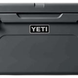 Yeti Tundra 65 Cooler - A large, rectangular cooler with a dark gray lid and matching body, featuring a handle on top and a logo in white lettering.