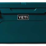 Yeti Tundra 65 Cooler - A large, rectangular cooler with a dark gray lid and matching body, featuring a handle on top and a logo in silver lettering that reads "YETI" on the front.