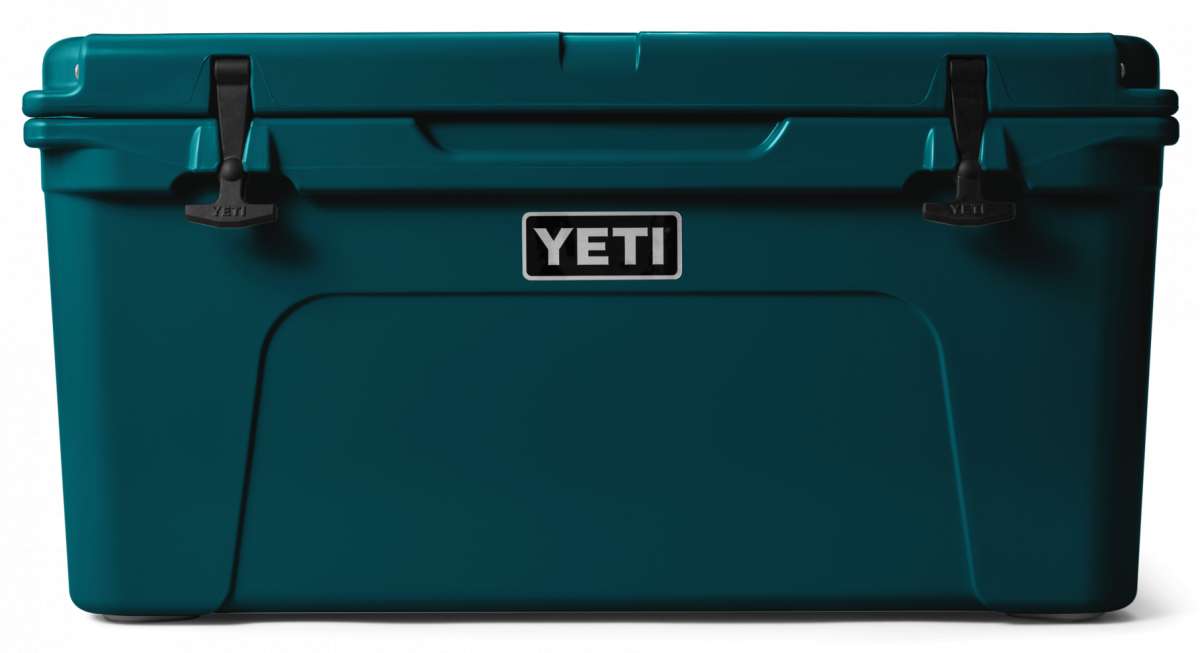 Yeti Tundra 65 Cooler - A large, rectangular cooler with a dark gray lid and matching body, featuring a handle on top and a logo in silver lettering that reads "YETI" on the front.