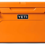 Yeti Tundra 65 Cooler - A large, rectangular cooler with a dark gray lid and matching body, featuring a handle on top and a logo in silver lettering.
