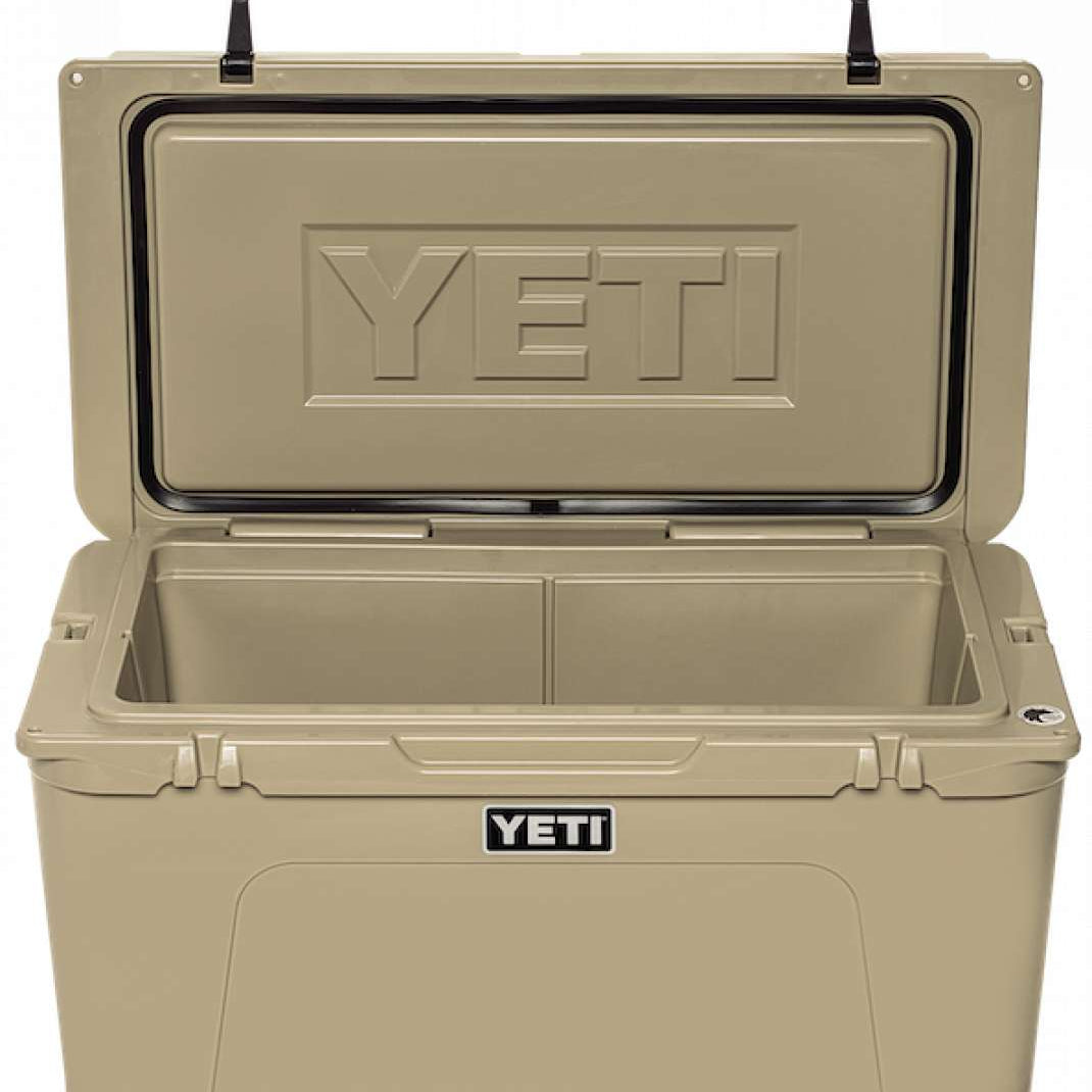 Yeti Tundra 75 Cooler - A large, tan cooler with a hinged lid and two black latches on top.