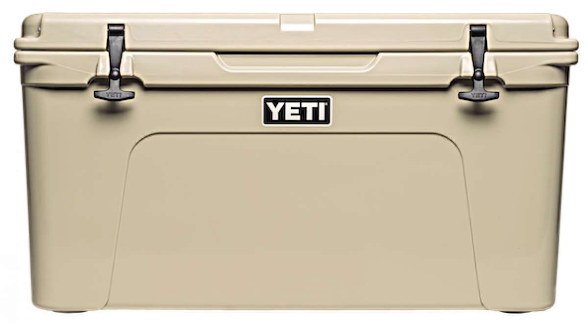 Yeti Tundra 75 Cooler - A large, tan cooler with a handle on top and two latches on either side of it.