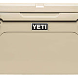 Yeti Tundra 75 Cooler - A large, tan cooler with a handle on top and two latches on either side of it.