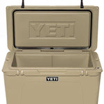 Yeti Tundra 75 Cooler - A large, tan cooler with a black handle on top and two latches on either side of the lid.