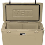 Yeti Tundra 75 Cooler - A large, tan cooler with a black handle on top and two latches on either side of the lid.